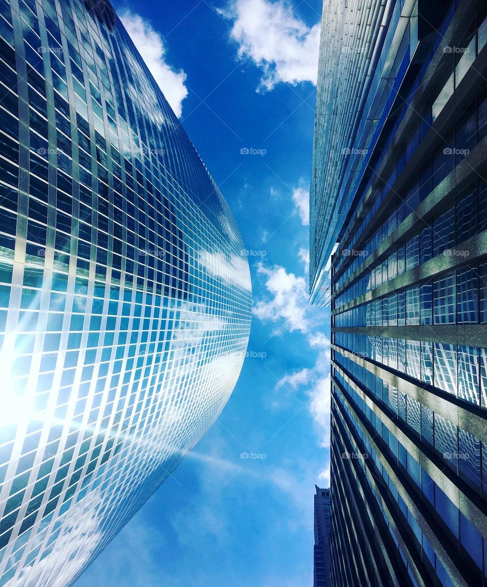 from where I stand, view from the ground in Chicago — vibrant blue skies and cloud reflections on the building windows — no filter needed, it was a bright and beautiful day — August 2016