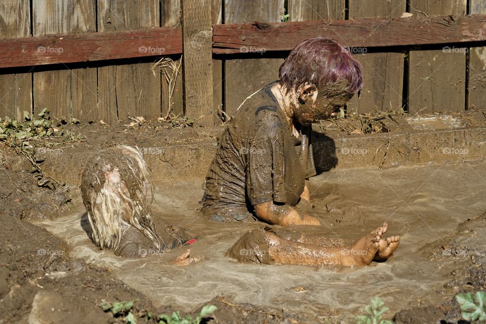 Boys Playing In Mud