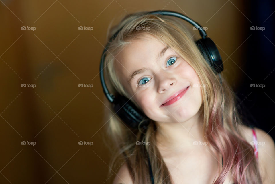 Smiling girl with headphones