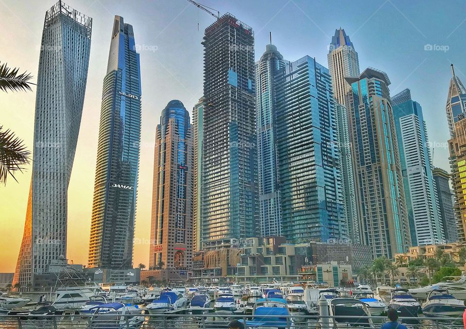 This beutiful sky scapper in Dubai Marina breath taking building beuyiful going gor hoildays sunset  and hot