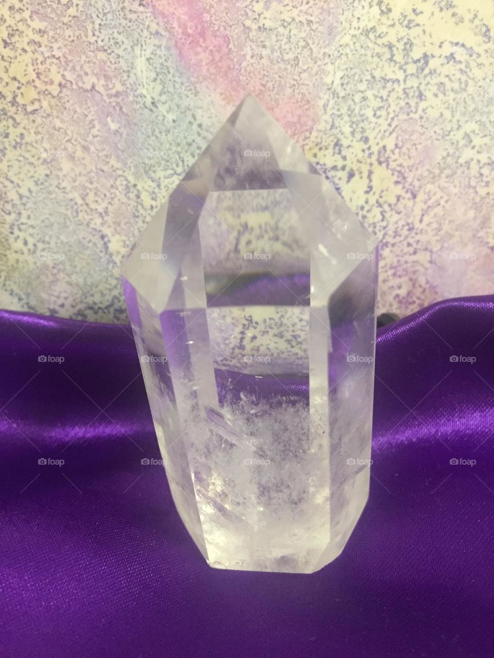 A Quartz Crystal Tower with a purple, blue, and pink background.