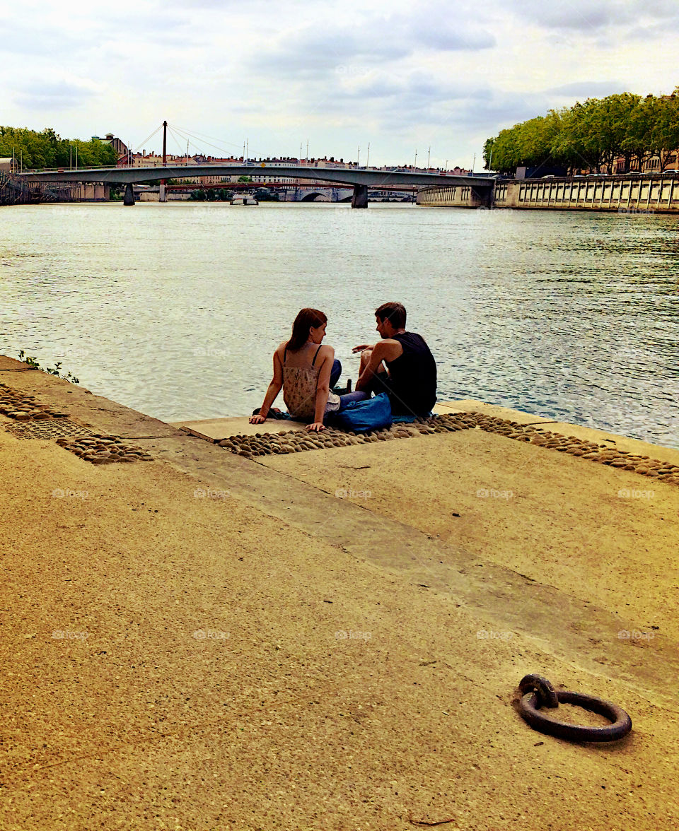 Couple sitting at the river 