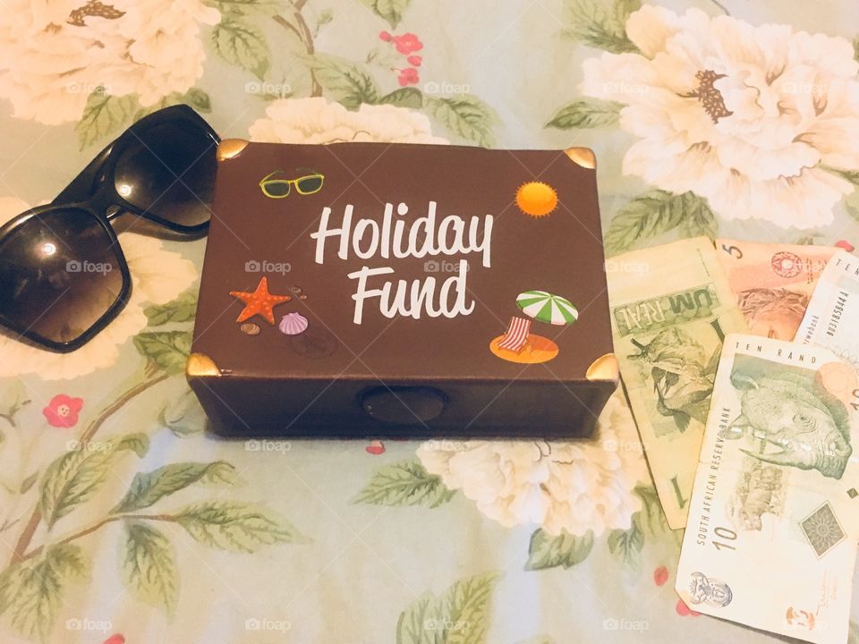 Holiday funds money and shades