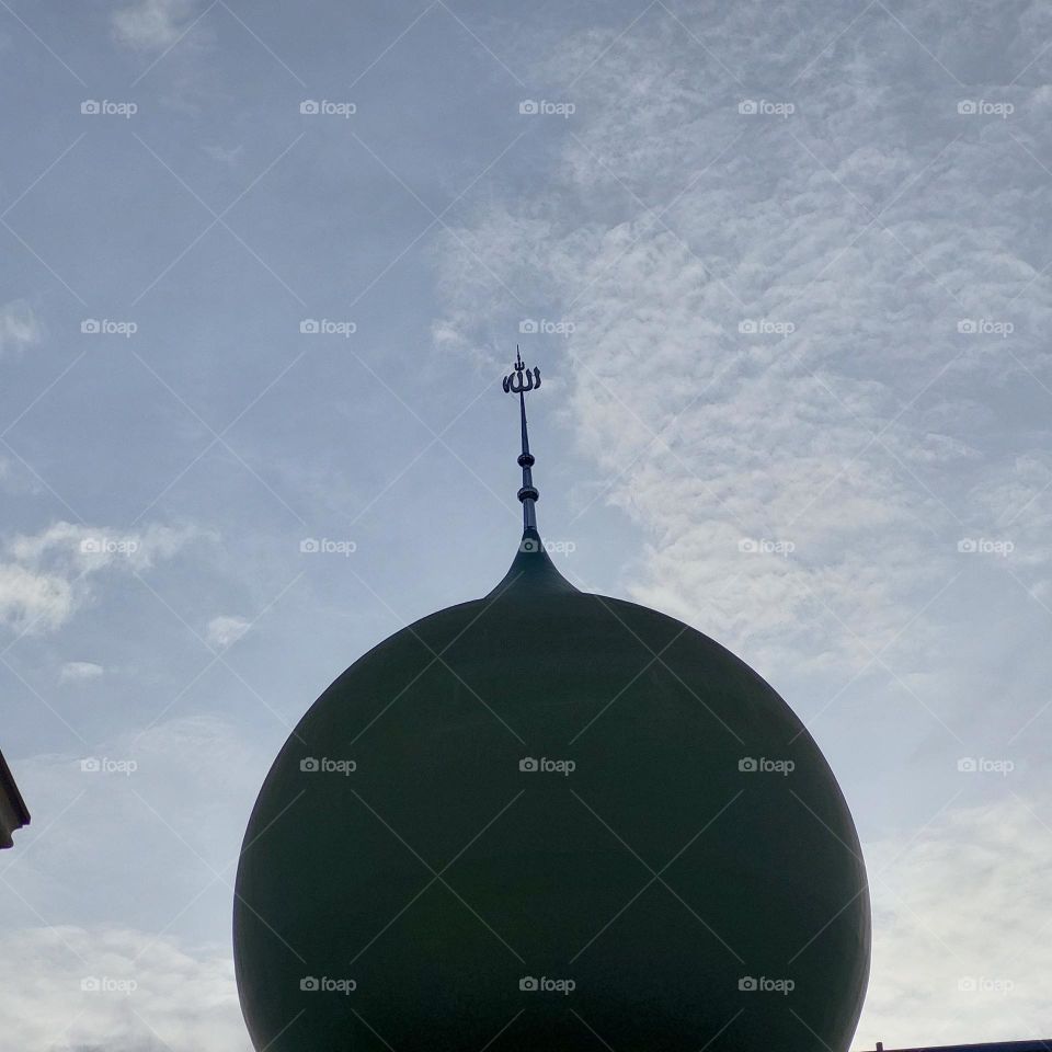 the mosque has a minaret, seen directly from below