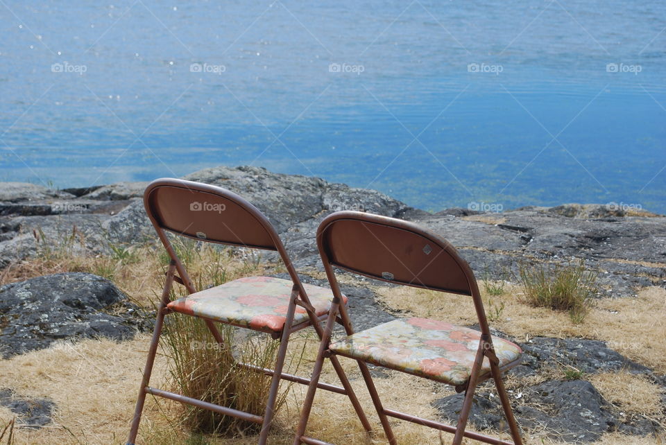 Old metal chair near the sea