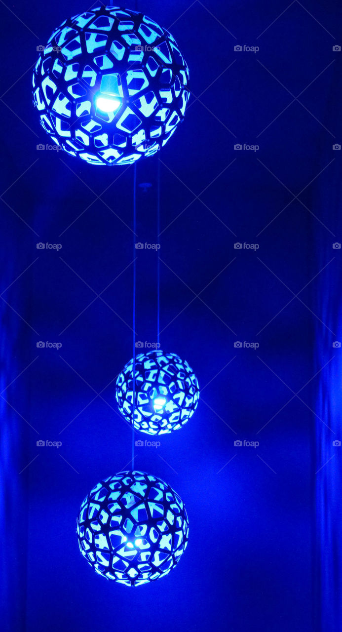 Blue orb lights suspended from the ceiling