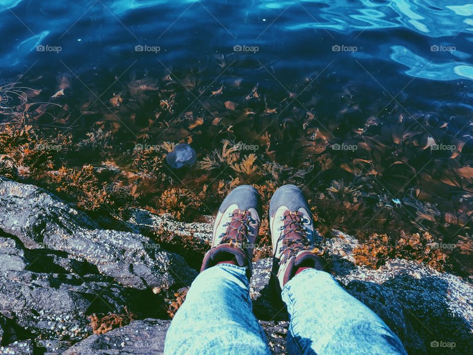 Hiking boots above the water 