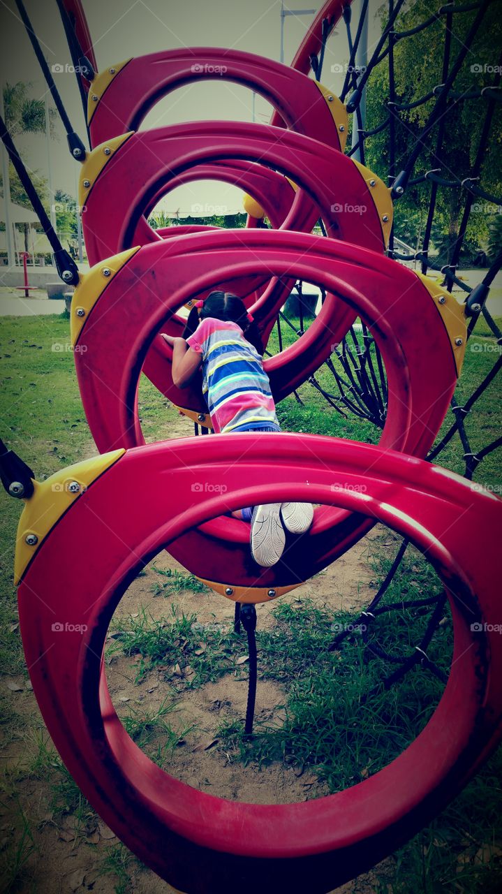 Girl in a red playground 2