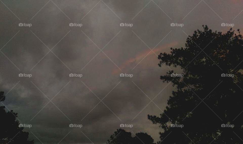 Cliche rainbow in the darkness.