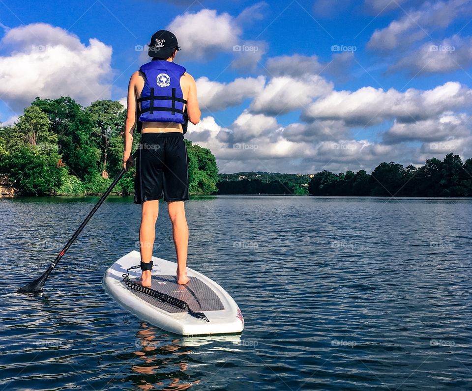 this is what we do out here in Austin, Texas for fun: paddle boarding. interesting, huh?