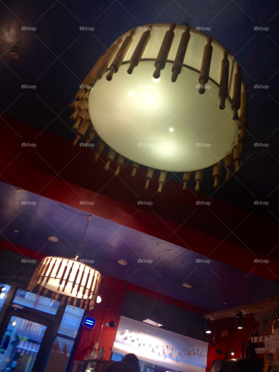 Ceiling lamp with rollers in a bakery