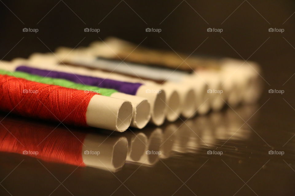 Thread rolls colorful with reflection 