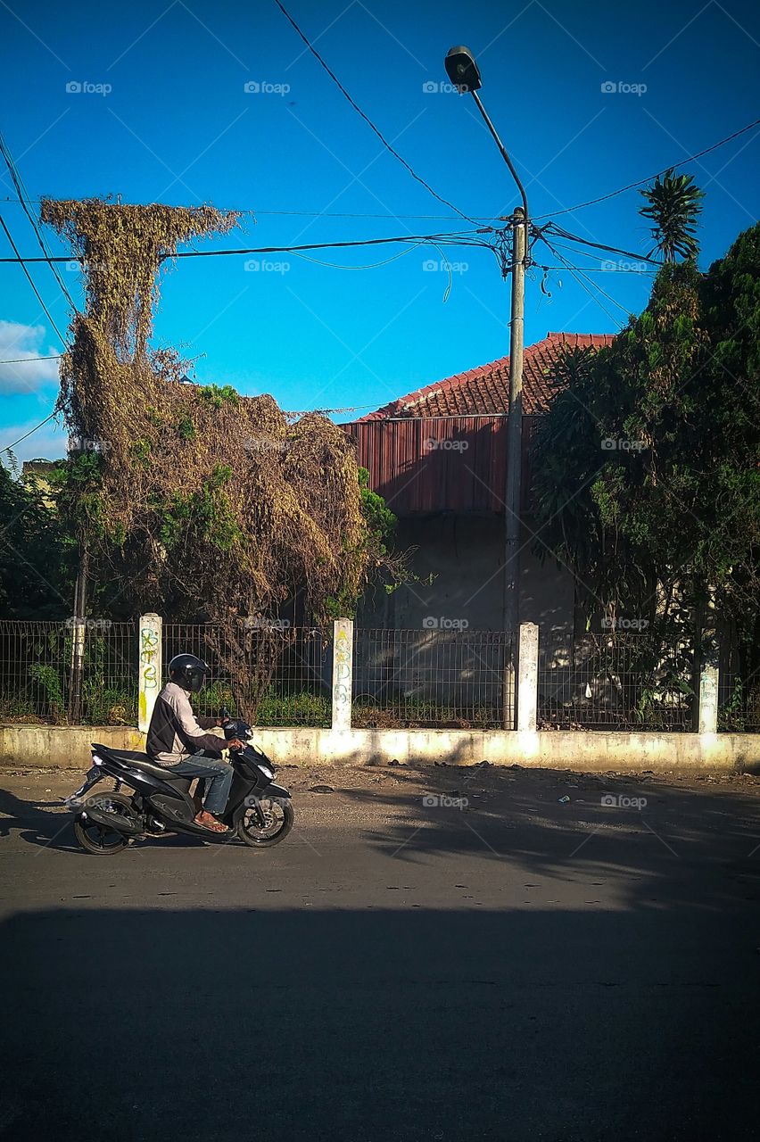 someone who was riding a motorcycle on the asphalt