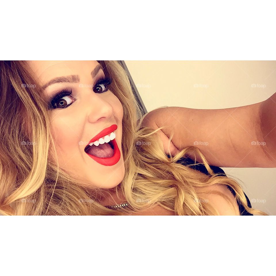 Attractive brunette model taking selfie