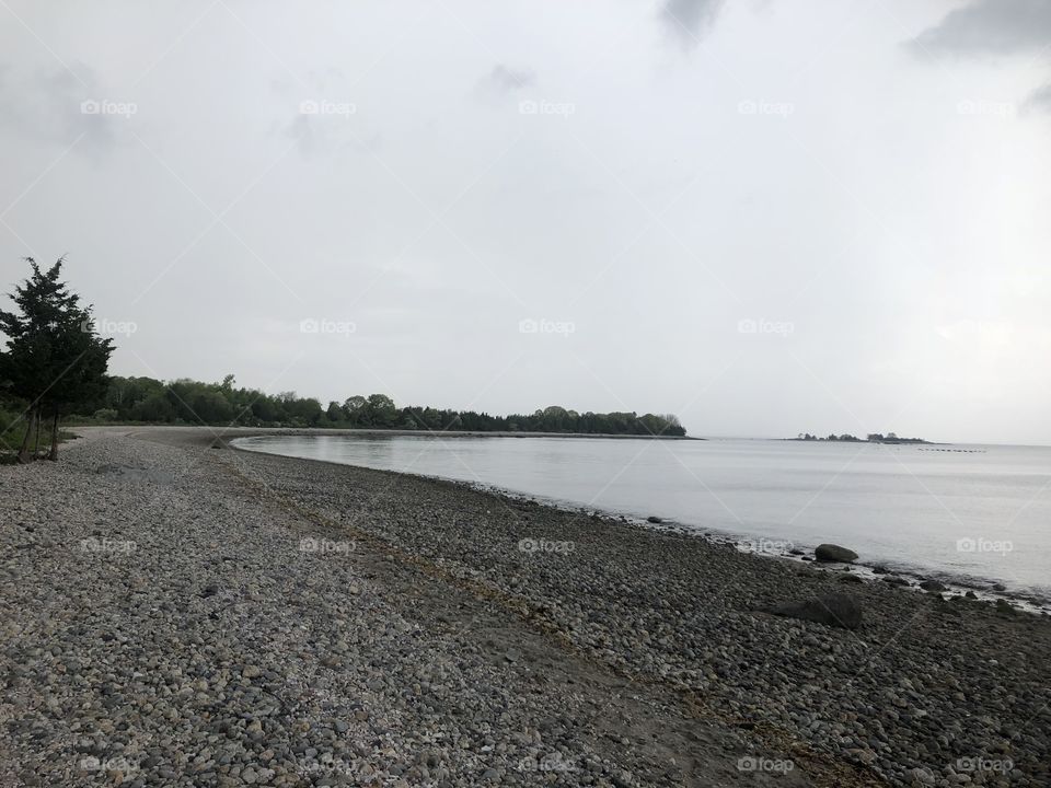 Gray skies over Rhode Island beach just before a summer rain storm