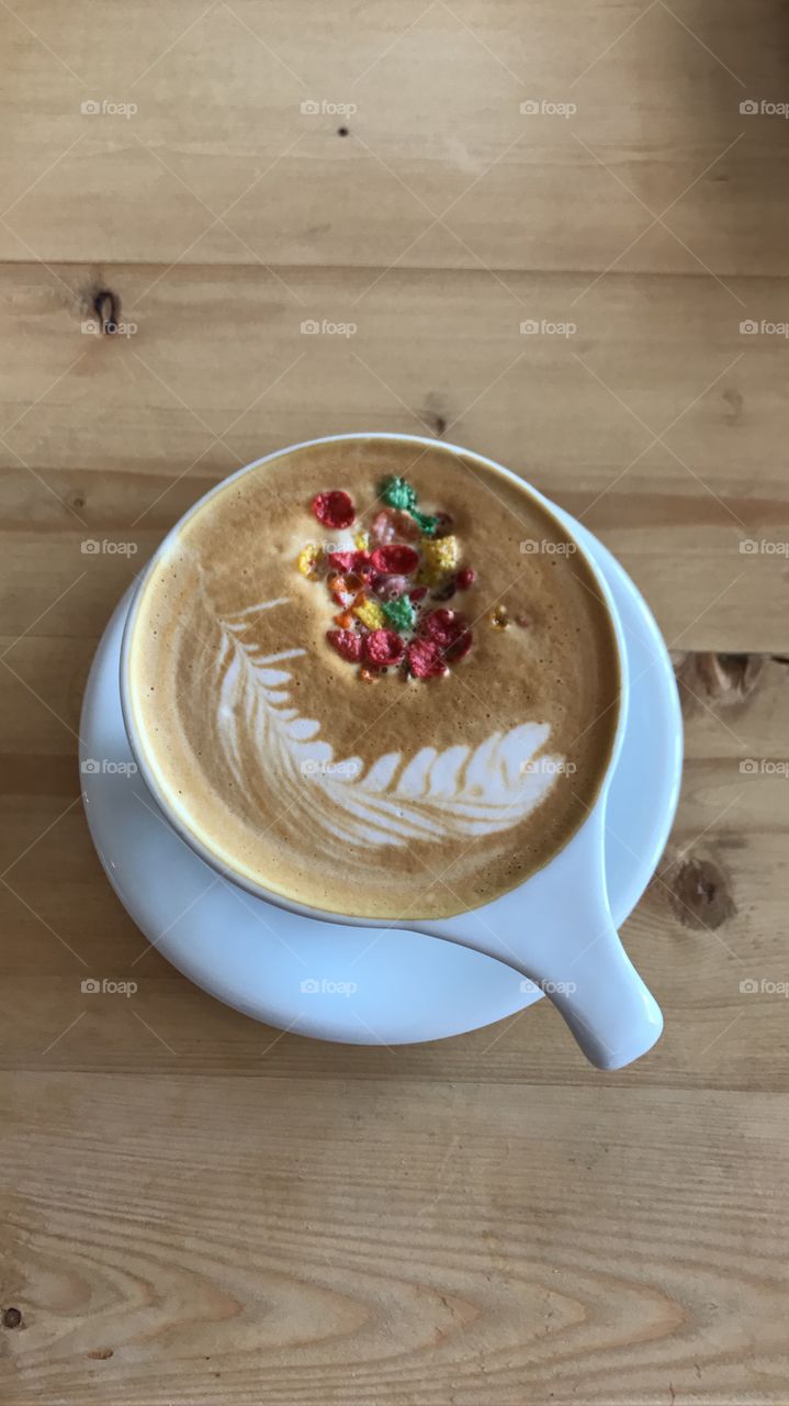 A gorgeous latte with Fruity Pebble accents! So colorful and fun, simplistic style with a surprise!