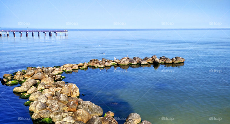 Stone pier over sea