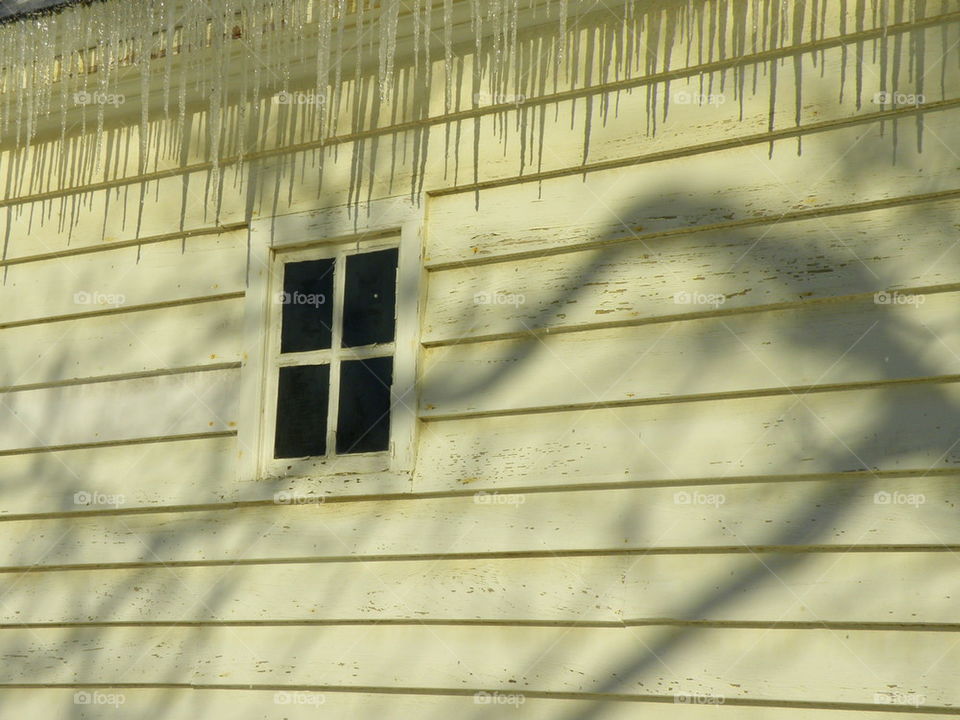 Barn window with shadows.