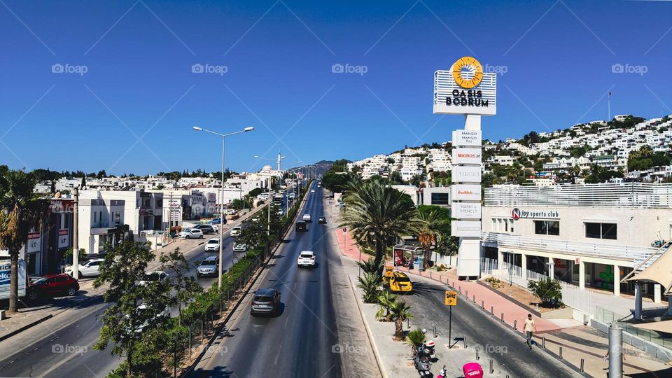 A beautiful view of the cars driving along the highway at evening twilight in Bodrum, Turkey, close-up from above.