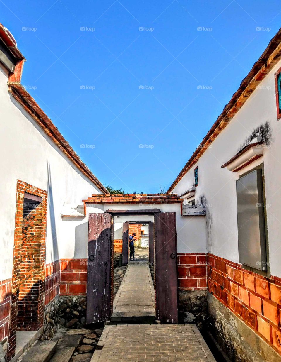Shapes: Rectangle. a beautiful historical Taiwan's family architecture. gates, doors windows, bricks, floor bricks all are rectangles. a famous place.