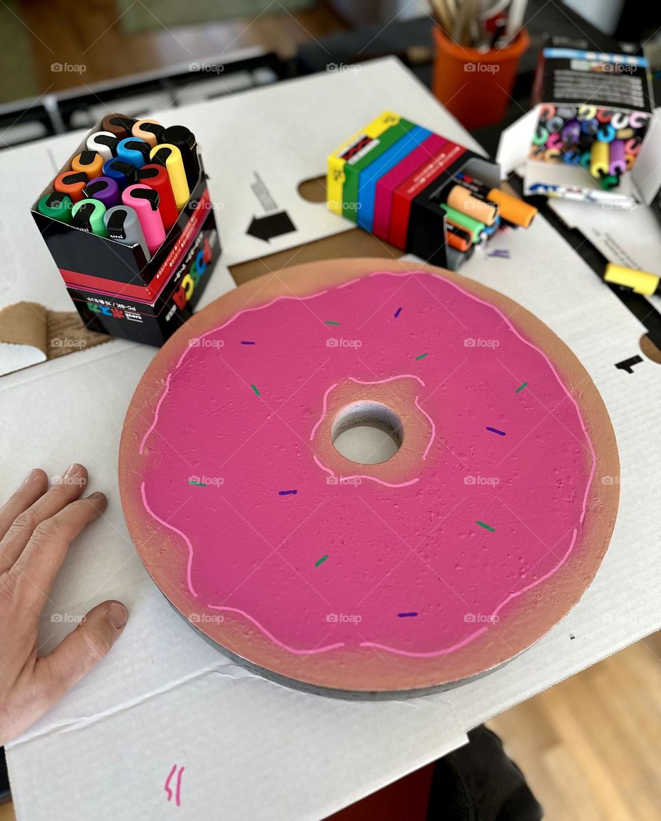 Making weight plates into donuts, pink donuts as weights, making fitness fun and silly, lifting donuts, 35 pound donuts, making weight plates look like donuts 