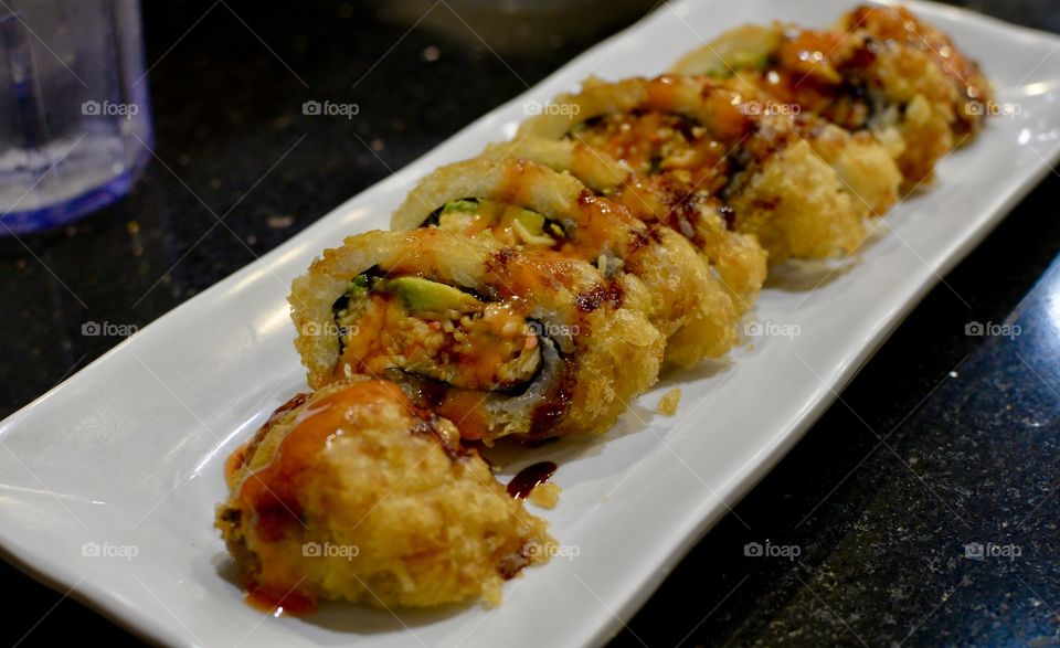Delicious scorpion roll on a plate 