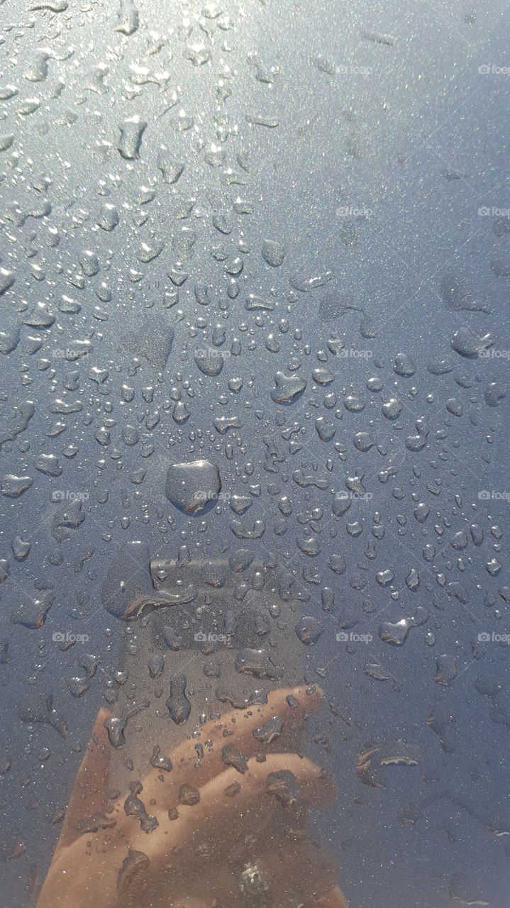 rain on car surface  rain drops
