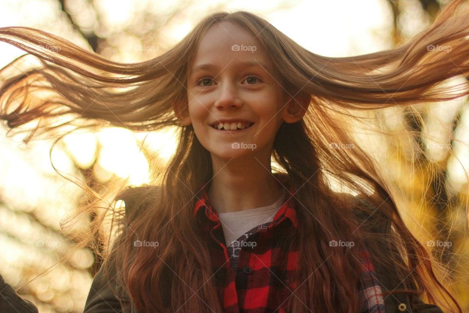 Girl with long hair smiling