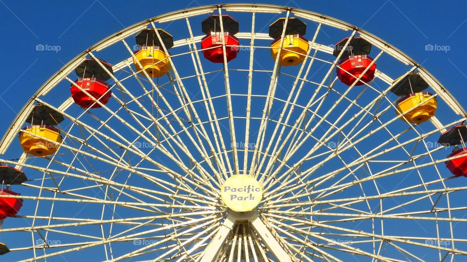 Half,colorful ferris wheel. Half,colorful ferris wheel into the sky