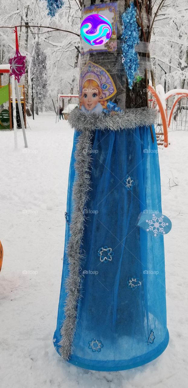 Birch dressed up before Christmas and New Year in the costume of the Snow Maiden