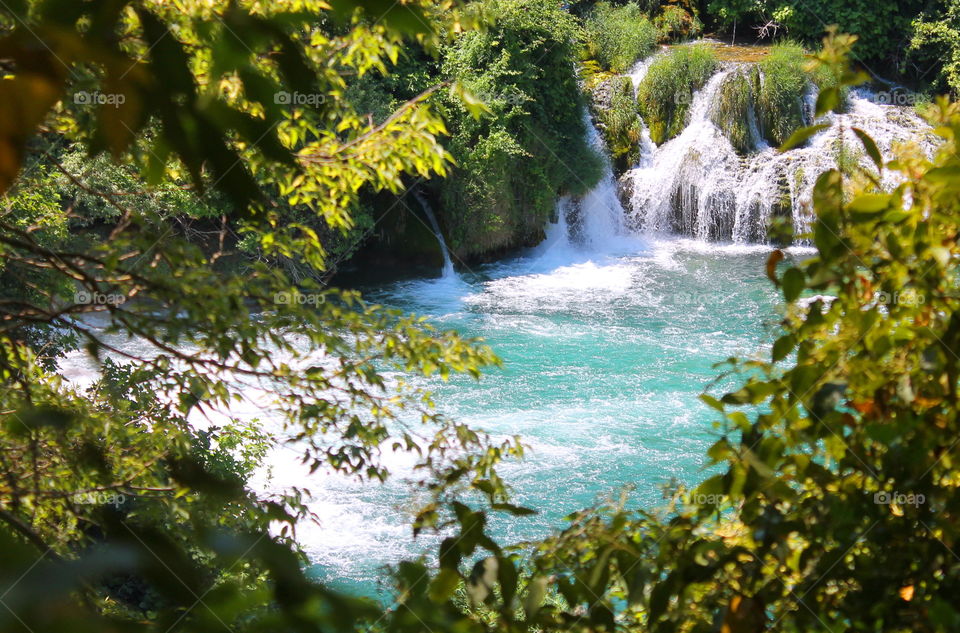 The view of waterfalls through forest