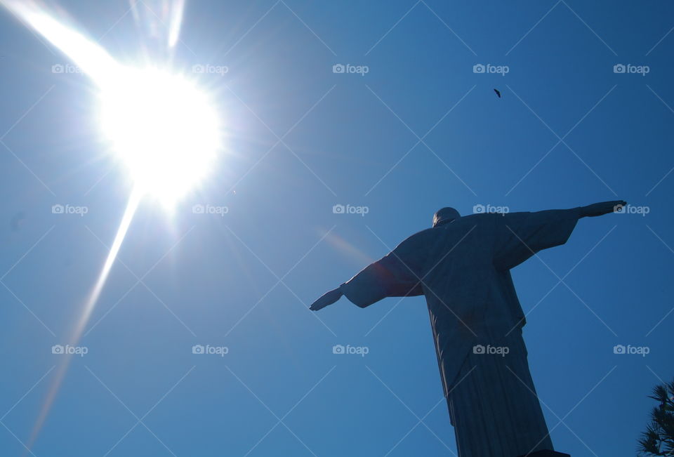 Cristo Redentor. an icon of Brazil and Rio, the Cristo Redentor shown here with the sun is the largest Art Deco statue in the world