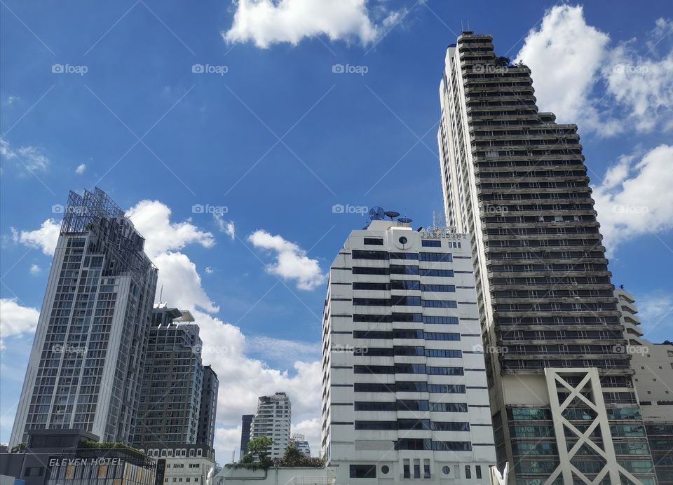 Buildings view with blue sky background.