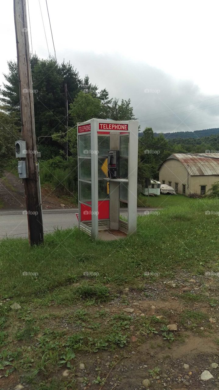 They do still exist! An endangered classic telephone booth along a small road in a rural Pennsylvania town.