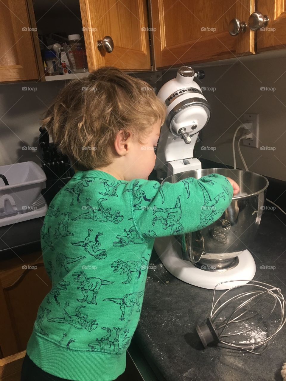 Helping mom make pancakes 