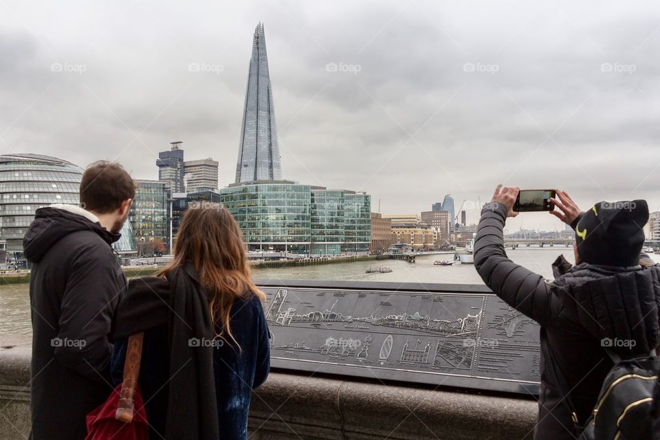 Tourists tacking picture of famous building in London,UK