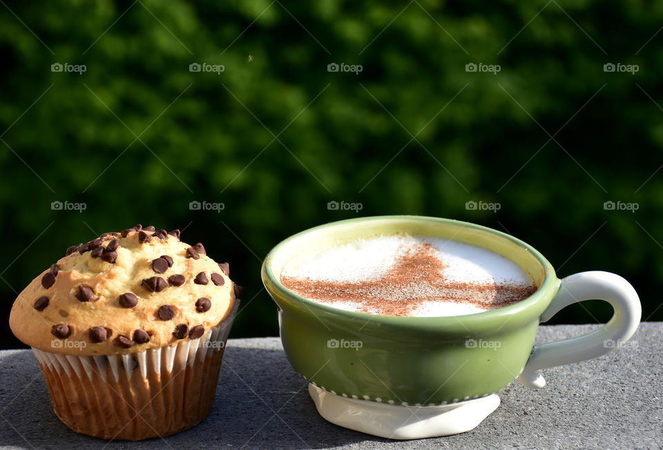 Cup of coffee with muffin