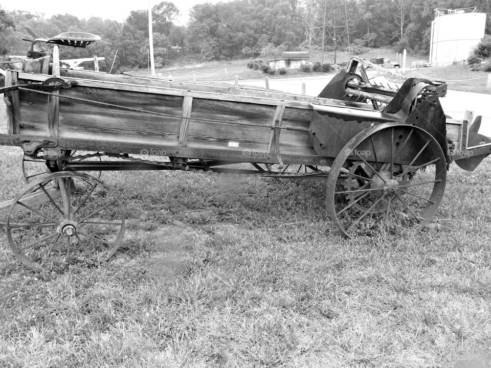 Vintage Vibes: A steel and wooden frame of a vintage John Deere manure spreader. 