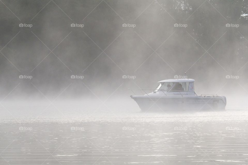 Boat sailing on lake