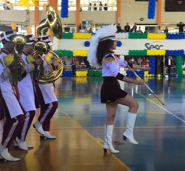 Martial band and beacon parading in sports gym