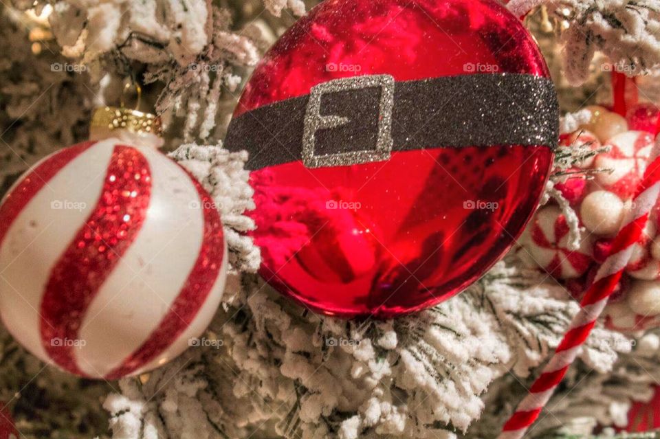 Santa ornament. A frosted tree with Santa ornaments. 