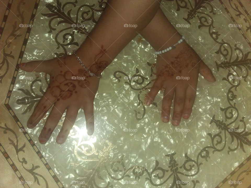 Beautiful hands decorated with henna.