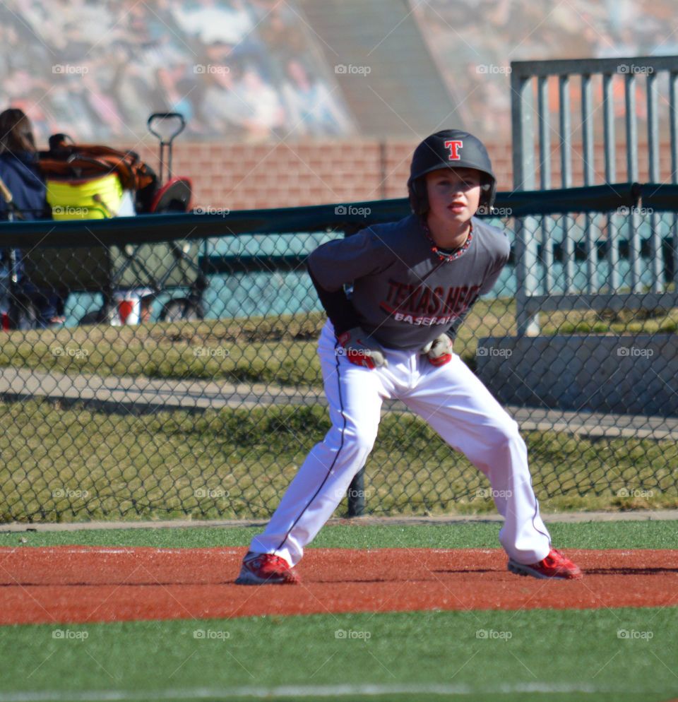 Teenager baseball player in stadium