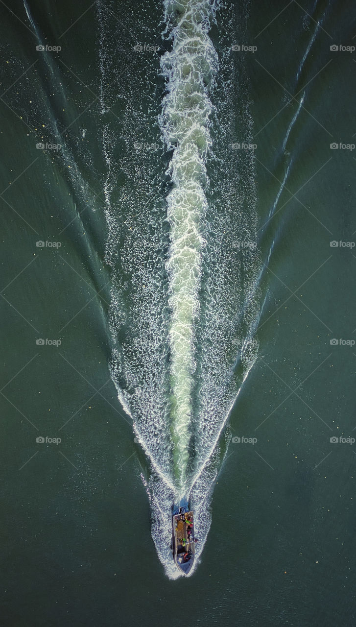 Motorboat wake on a waterway 