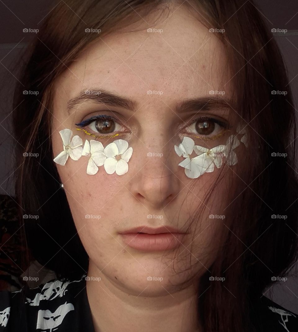 Portrait of a girl with white leaves