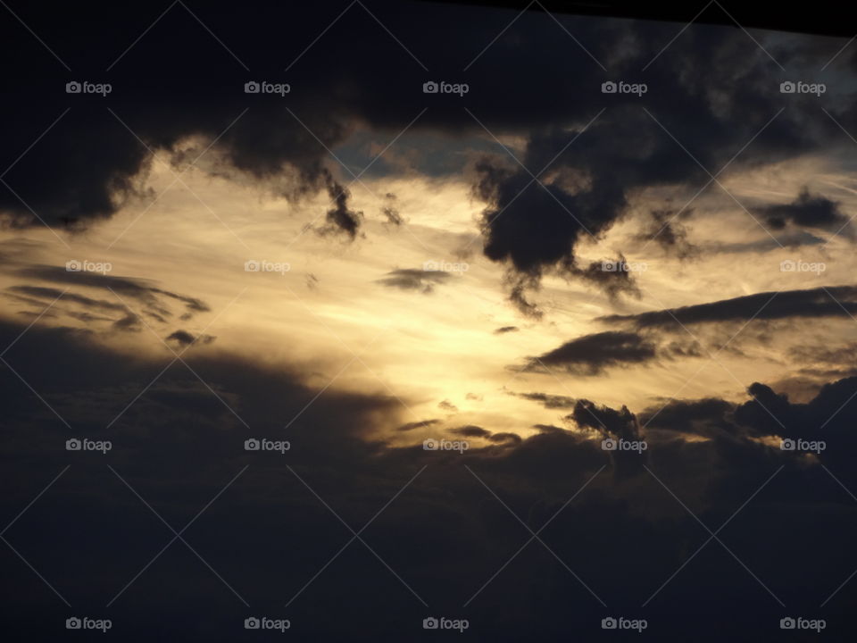 Golden Hour after rain. Golden hour after a rain & the sun emerging from  dark clouds