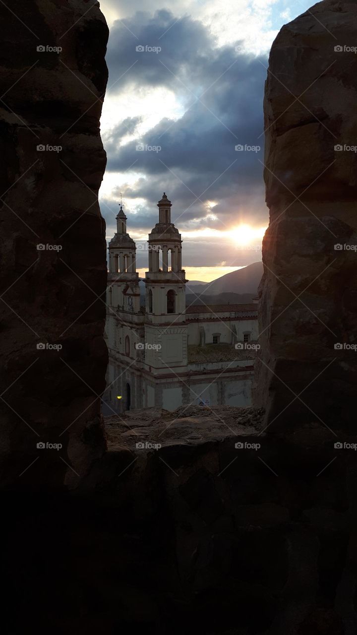 sunset between stones