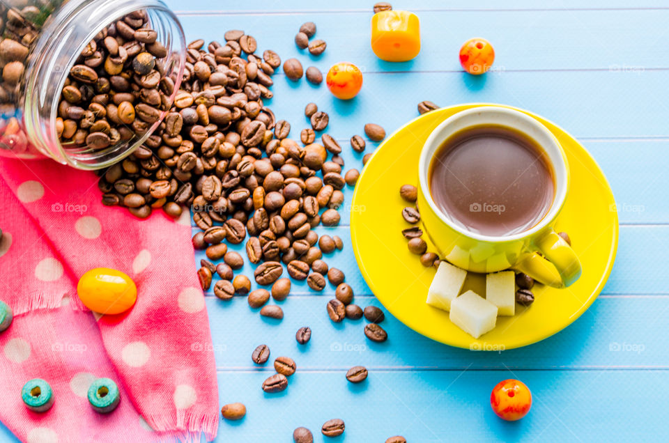 Coffee beans and coffee cup