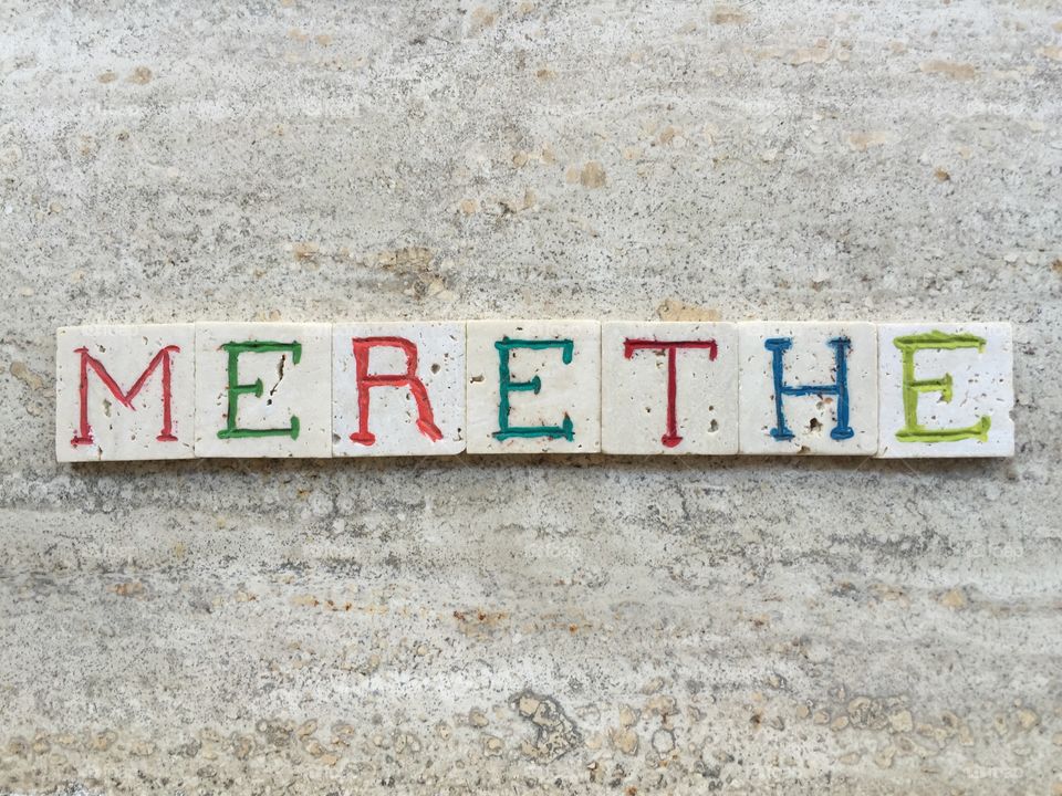 Merethe, female name . Composition with carved travertine pieces of Merethe, female name 