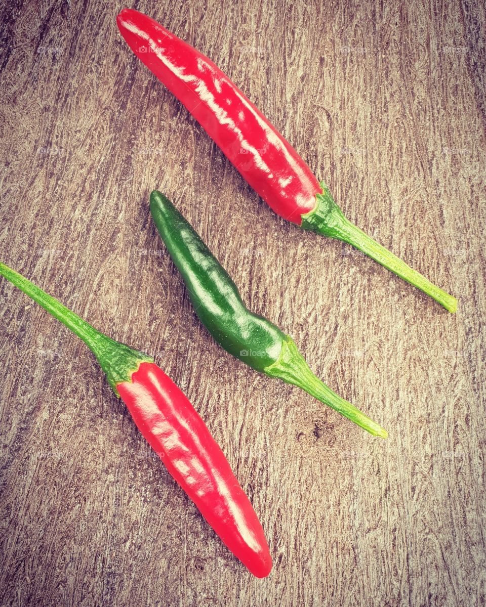 Beautiful warm colors of a trio of home grown chillies.